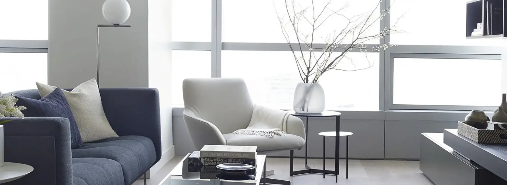 AKA University City cozy living room in neutral tones with high finishes