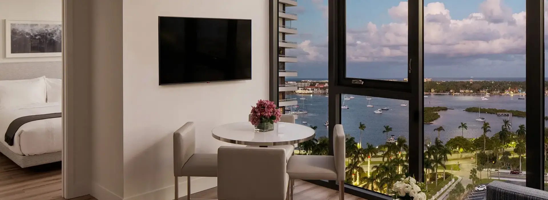 AKA West Palm apartment with large floor to ceiling window overlooking the bay