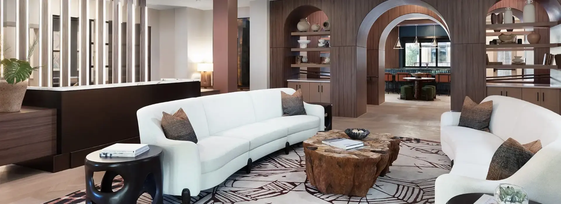 AVE Paradise Valley lounge with white sofas and dark wooden panels