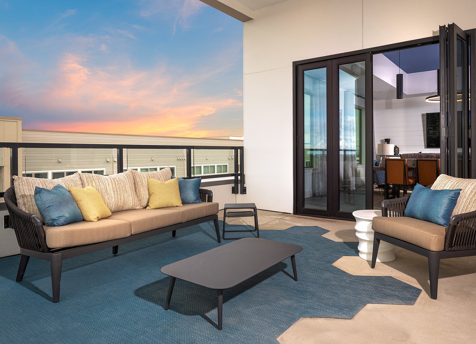 Rooftop terrace with sofa and view of the sky at AVE Austin apartment building.
